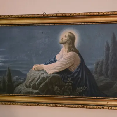 Vintage framed print of Christ in the Garden of Gethsemane, housed in a wide, ornate gold-finished frame.