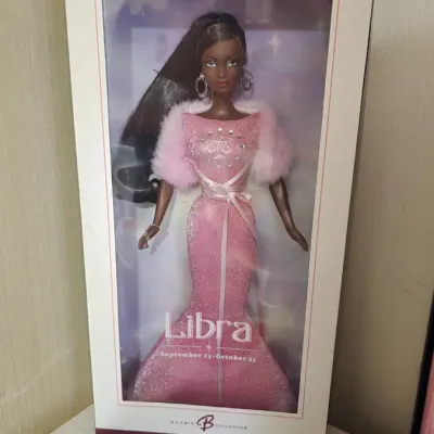 Barbie Collector Pink Label Libra doll, new in original box, featuring a pink gown and faux fur stole.