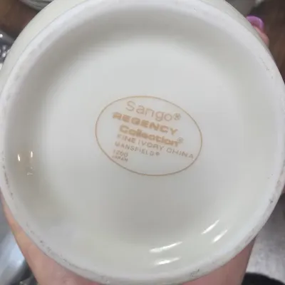 Sango Regency Collection fine ivory china in the Mansfield pattern, showing the maker's mark on the underside of a piece.