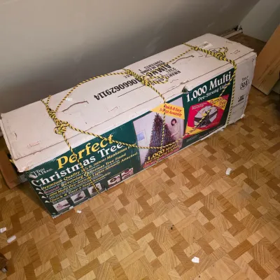 Sale Photo Thumbnail #16: Trim A Home "Perfect Christmas Tree" in its original box, featuring 1,000 pre-strung multi-colored lights and a revolving stand.