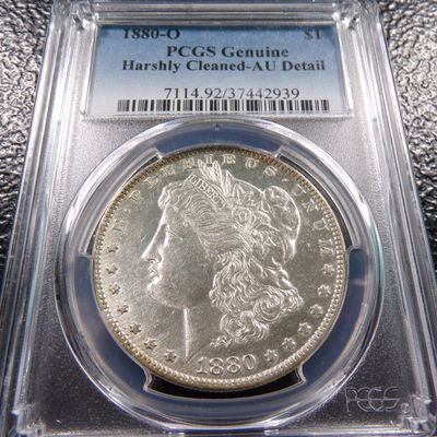 1880-O PCGS AU. DETAIL MORGAN SILVER DOLLAR GENUINE HARSHLY CLEANED