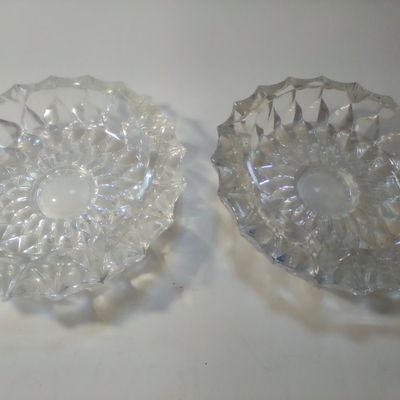 A Pair of Vintage Pressed Colorless Glass Ashtrays with Geometric Sunburst Pattern