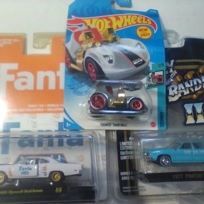 A Trio of Die-Cast Model Vehicles Including Hot Wheels, M2 Machines, and GreenLight Collectibles