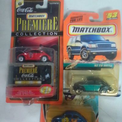 Three Matchbox Die-Cast Volkswagen Beetle Models in Original Packaging
