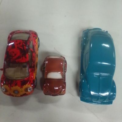 Three Volkswagen Beetle Collectibles Including an Avon Aftershave Decanter