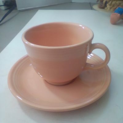 A Homer Laughlin Fiestaware Apricot Glazed Cup and Saucer Set