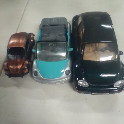 Three Toy Volkswagen Beetle Model Cars