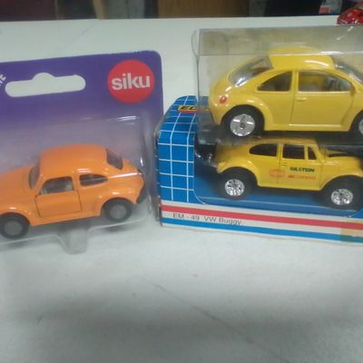 Three Die-Cast Volkswagen Beetle Model Cars Including Siku and Edocar Examples