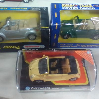 Three Volkswagen New Beetle Convertible Die-Cast Model Cars including Maisto and Kid Connection Power Racer