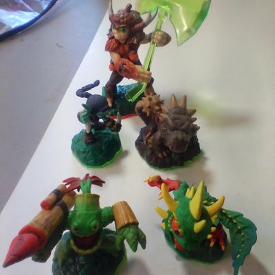 A Collection of Skylanders Interactive Game Figures Including Trap Master Bushwhack