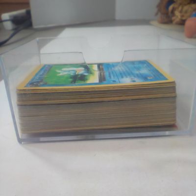 An Assortment of Wizards of the Coast Era Pokemon Trading Cards Featuring Dark Warturtle