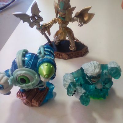 Three Skylanders Video Game Interactive Figures Including Golden Queen, Dive-Clops, and Slam Bam