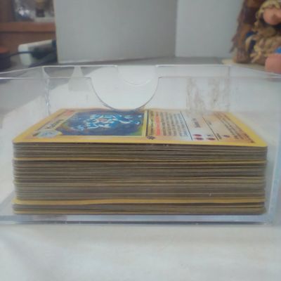 A Collection of Early Edition Pokémon Trading Cards Including 1st Edition Machamp Holographic Base Set 8/102