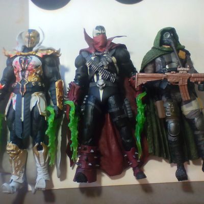 Three Articulated Plastic Action Figures Including Redeemer and Commando Spawn