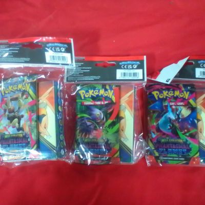 Three Sealed Pokemon Trading Card Game Mini Portfolios with Mega Evolution Phantasmal Flames Booster Packs