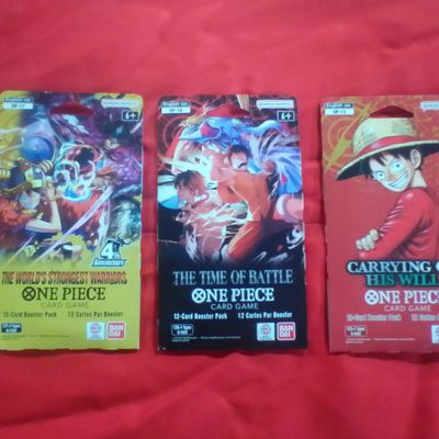 Three Sealed One Piece Card Game Blister Booster Packs Including The World Strongest Warriors The Time of Battle and Carrying On His Will