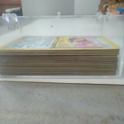 Collection of Vintage Pokemon Trading Cards in Clear Plastic Case