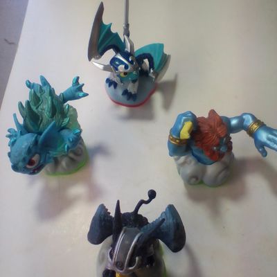 A Group of Four Skylanders NFC Video Game Figures Including Series 1 and Swap Force Characters