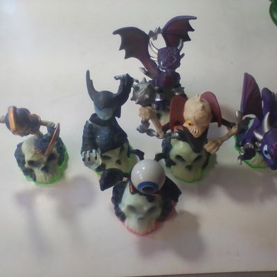 A Collection of Skylanders Interactive Toy Figures Including Spyro and Undead Element Characters