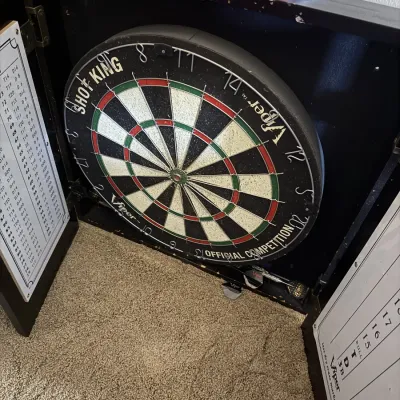 Viper Shot King official competition dartboard housed in a black wooden cabinet with dry-erase scoreboards.