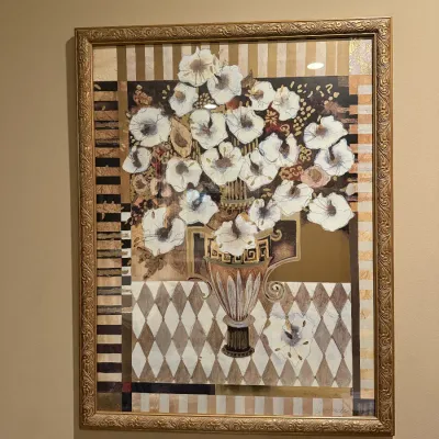 Framed contemporary floral still life art print depicting white flowers in an ornate vase against a geometric background, set in an...