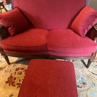 Red loveseat with ottoman