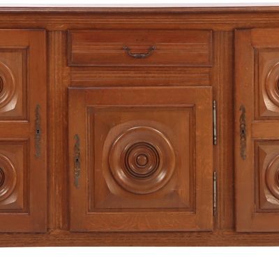THREE DOOR FRENCH OAK SIDEBOARD HAVING CIRCULAR DESIGN IN THE MANNER OF CHARLES DUDOUYT C 1940.