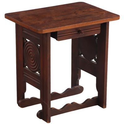 FRENCH OAK OCCASIONAL TABLE HAVING A SINGLE DRAWER AND CIRCULAR DESIGN IN THE MANNER OF CHARLES