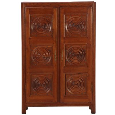 FRENCH TWO DOOR OAK CABINET IN THE MANNER OF DUDOUYT HAVING CIRCULAR AND METAL STUD DECORATION