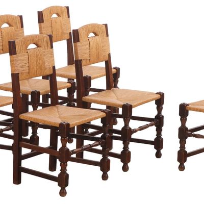SIX FRENCH OAK AND RUSH DINING CHAIRS HAVING A WRAPPED EFFECT IN THE MANNER OF CHARLES DUDOUYT C