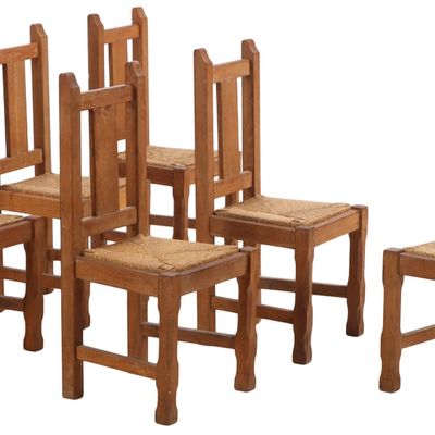SIX BELGIAN BRUTALIST STYLE OAK AND RUSH DINING CHAIRS C 1960.