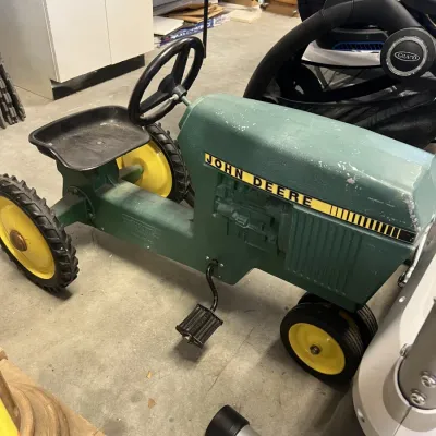 Vintage John Deere cast metal pedal tractor 