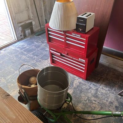 Sale Photo Thumbnail #31: Red Craftsman tool chest paired with a vintage pleated lampshade, a white toaster, and a green lawn spreader.
