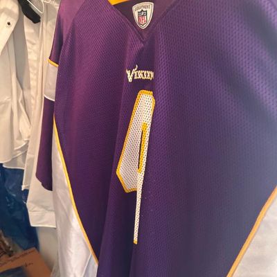 Sale Photo Thumbnail #70: Minnesota Vikings NFL Equipment jersey featuring Brett Favre's number 4 in purple, gold, and white.