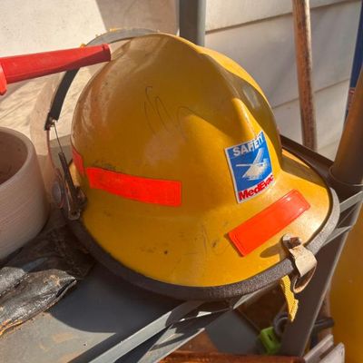 Sale Photo Thumbnail #105:  helmet featuring a MedEvac safety sticker and orange reflective tape.