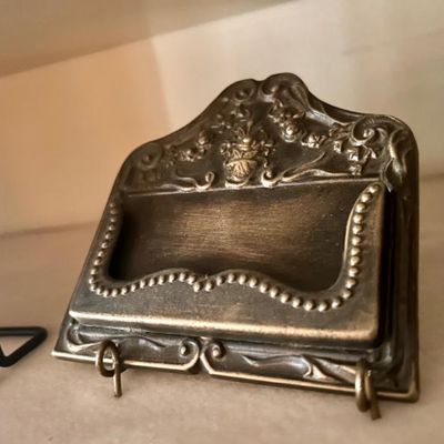 Sale Photo Thumbnail #23: Vintage ornate brass business card holder featuring floral and beaded details.