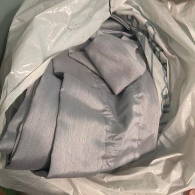 Sale Photo Thumbnail #81: Light blue or silver fabric curtains with a subtle texture.