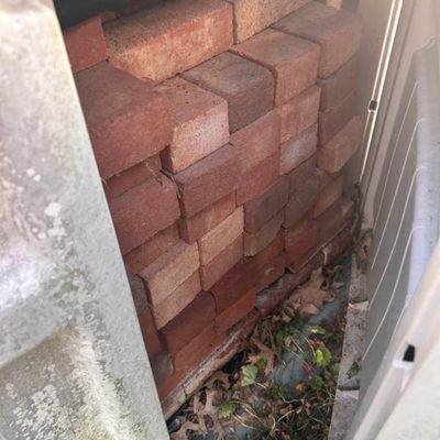 Sale Photo Thumbnail #95: Stack of standard red clay construction bricks.