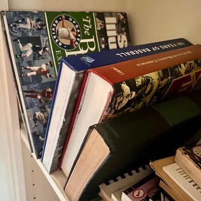 Sale Photo Thumbnail #92: Collection of hardcover sports history books, including "100 Years of Baseball" and "The Baseball Encyclopedia".