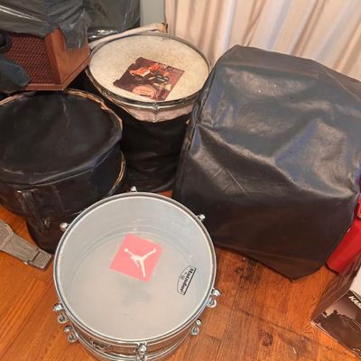 Sale Photo Thumbnail #29: Matador snare drum shown alongside other drums, cases, and musical equipment.