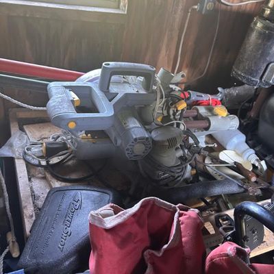 Sale Photo Thumbnail #107: Ryobi miter saw shown alongside a Power-Shot staple gun case and other assorted tools.