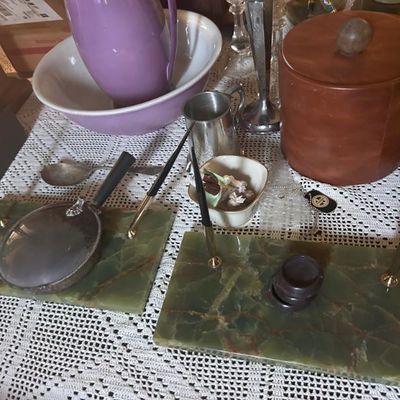 Sale Photo Thumbnail #122: Vintage green onyx double pen desk sets, shown alongside a leather ice bucket, purple ceramic pitcher, and other assorted tabletop collectibles.