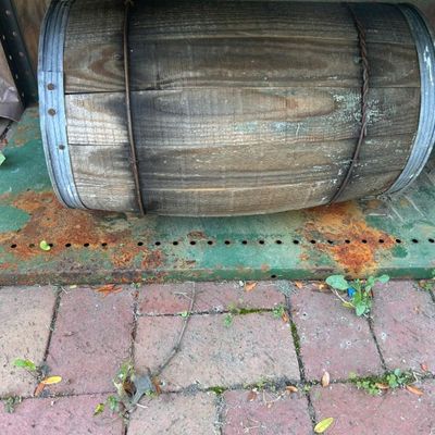 Sale Photo Thumbnail #120: Vintage wooden barrel with metal bands.