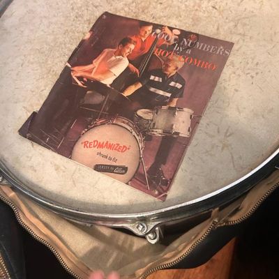 Sale Photo Thumbnail #115: Vintage snare drum in a zippered carrying case, featuring a mid-century promotional insert titled "Cool Numbers by a Hot Combo."
