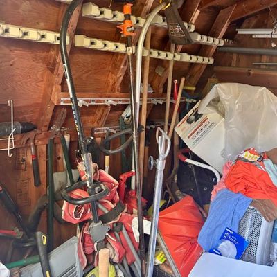 Sale Photo Thumbnail #98: Assorted lawn and garden tools, including string trimmers, shovels, and shears.