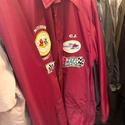 Sale Photo Thumbnail #17: Vintage red Chevrolet Corvette club jackets featuring embroidered patches and custom name details.
