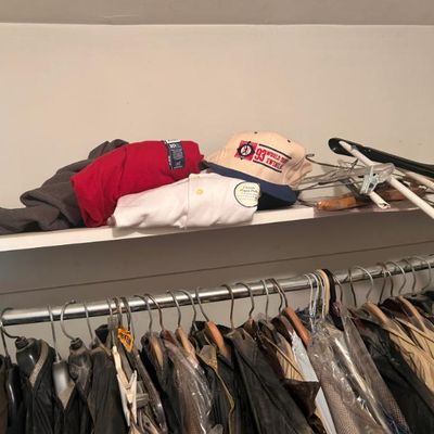 Sale Photo Thumbnail #21: Assorted clothing items including a red t-shirt, a white polo shirt, and a 1993 World Series baseball cap.
