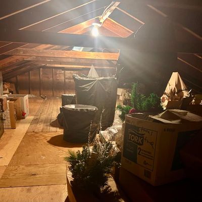Sale Photo Thumbnail #88: Assorted holiday decorations, storage boxes, and wrapped items.