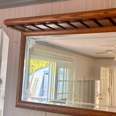 Sale Photo Thumbnail #99: Oak-framed wall mirror featuring an integrated overhead stemware rack and etched Art Deco corner details.