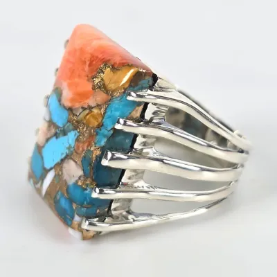 Sterling silver statement ring featuring a large, multi-colored composite stone of turquoise, spiny oyster shell, and bronze matrix,...